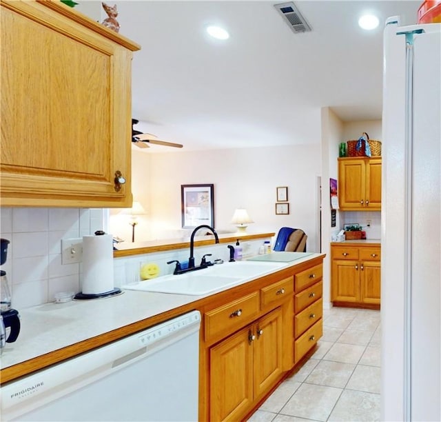 kitchen with backsplash, white appliances, ceiling fan, sink, and light tile patterned floors