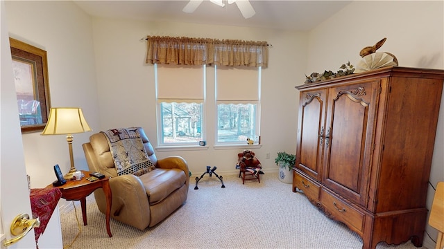 sitting room with light carpet and ceiling fan