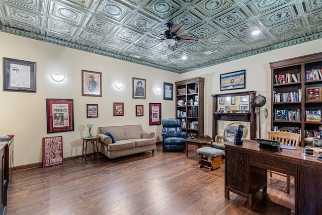 office space with ceiling fan and dark hardwood / wood-style floors