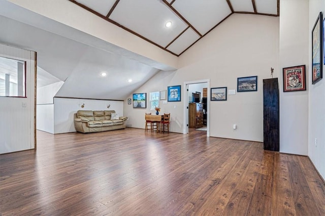 living room featuring hardwood / wood-style floors and vaulted ceiling