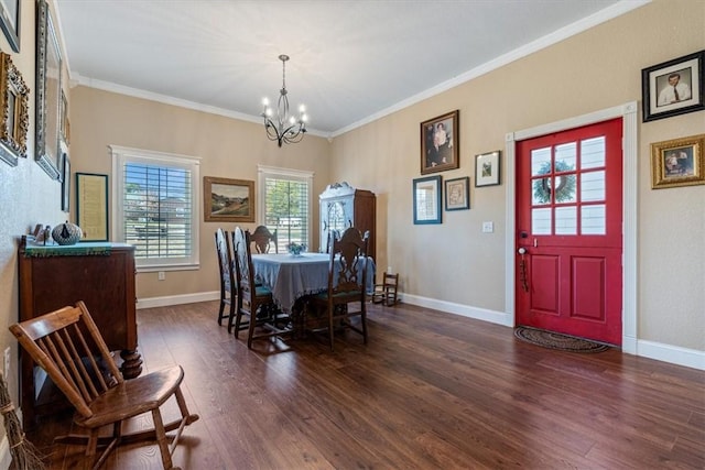 dining area with a chandelier, dark hardwood / wood-style floors, and crown molding