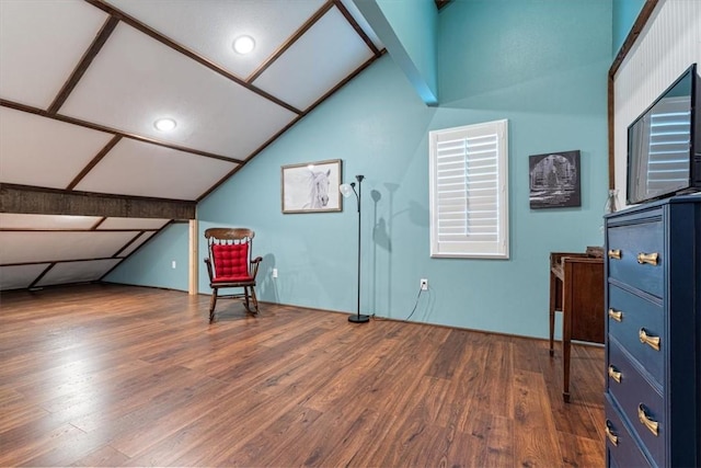 sitting room featuring dark hardwood / wood-style flooring and lofted ceiling