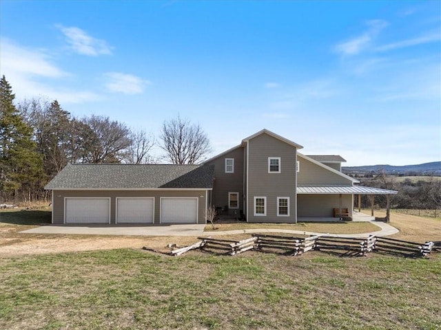 view of front facade with a garage and a front lawn