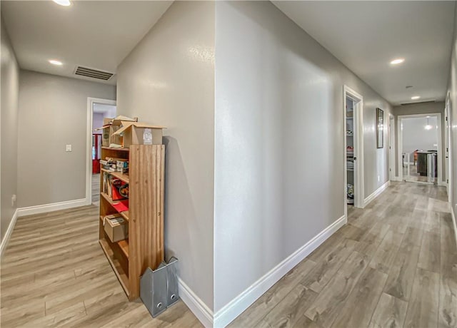 corridor featuring light hardwood / wood-style flooring