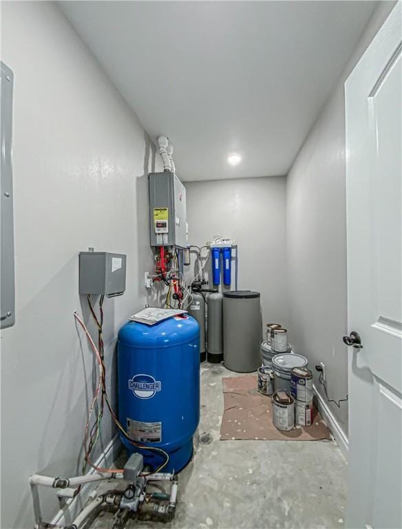 utility room featuring water heater