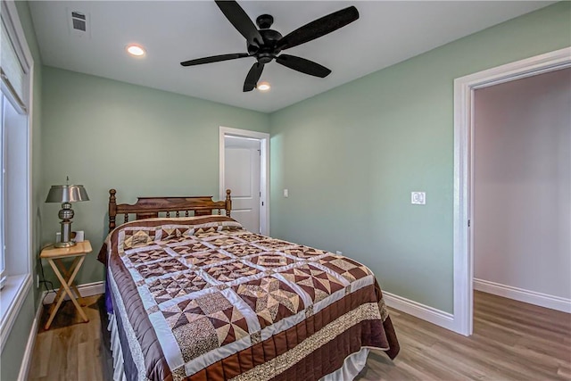 bedroom with light wood-type flooring and ceiling fan