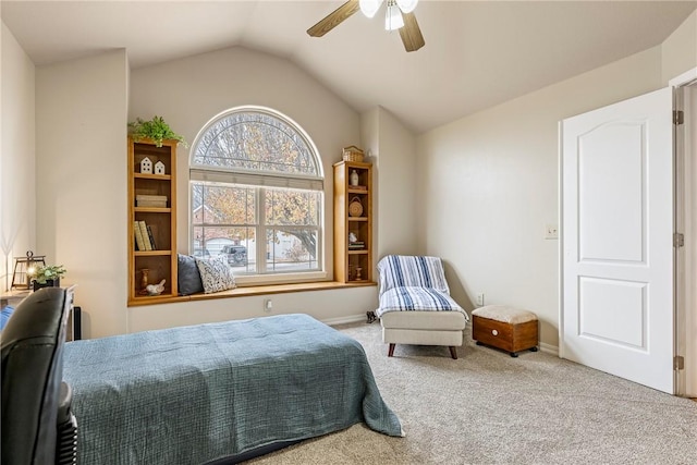 carpeted bedroom with ceiling fan and lofted ceiling