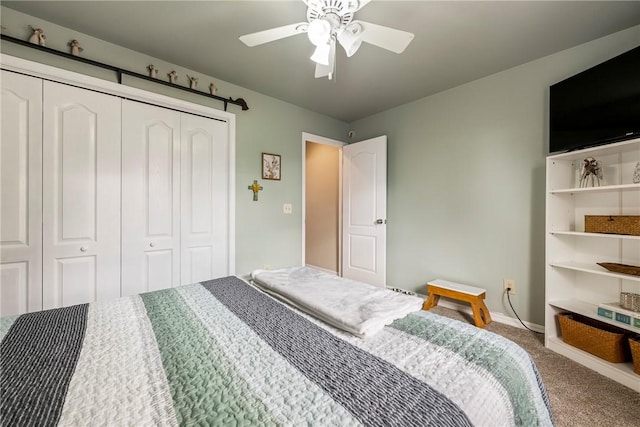 carpeted bedroom featuring ceiling fan and a closet