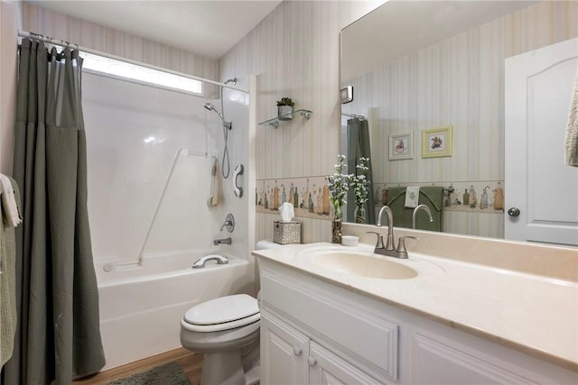 full bathroom featuring shower / tub combo, vanity, hardwood / wood-style flooring, and toilet