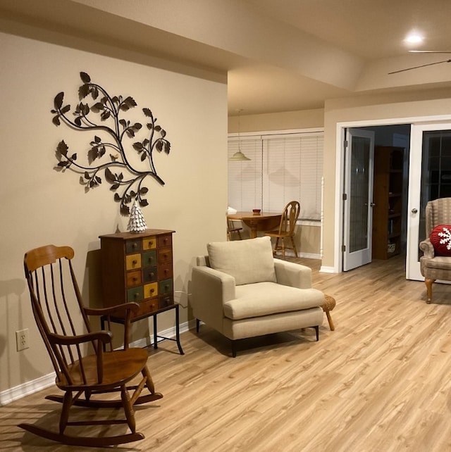 living area with light hardwood / wood-style flooring