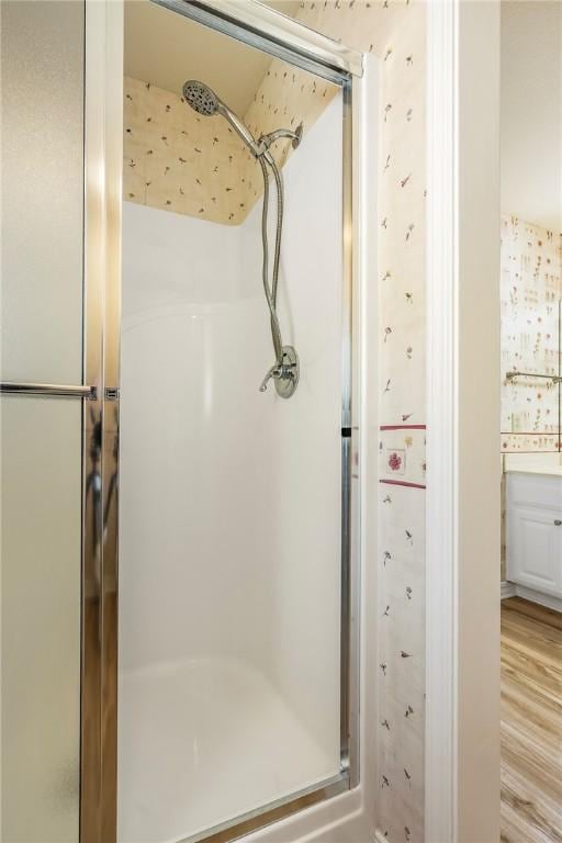 3 Barrhead Ln, Bella Vista, AR 72715 - full bathroom with a stall shower and wood finished floors