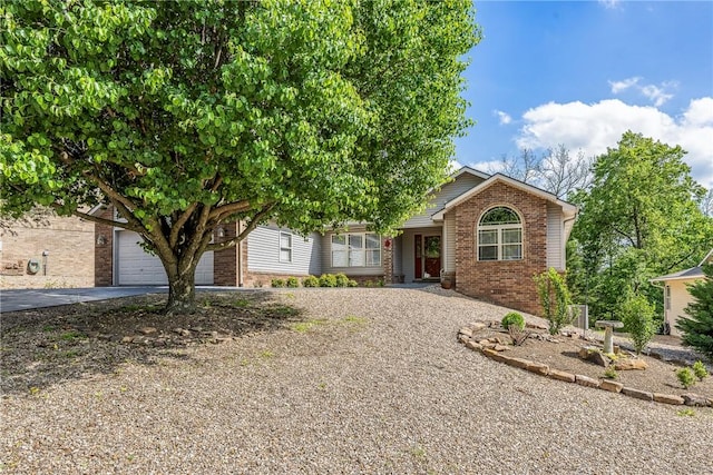 3 Barrhead Ln, Bella Vista, AR 72715 - view of property hidden behind natural elements with brick siding and driveway