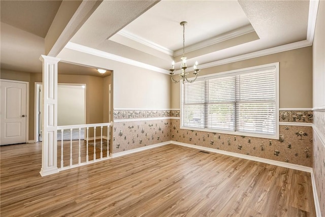 3 Barrhead Ln, Bella Vista, AR 72715 - empty room featuring wood finished floors, a tray ceiling, wallpapered walls, a notable chandelier, and baseboards