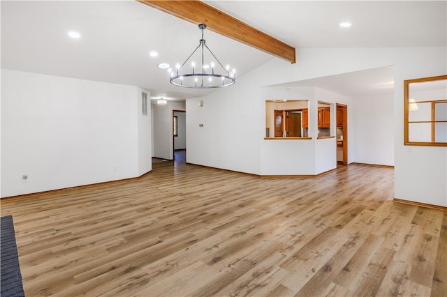 unfurnished living room featuring lofted ceiling with beams, a notable chandelier, and light wood-type flooring