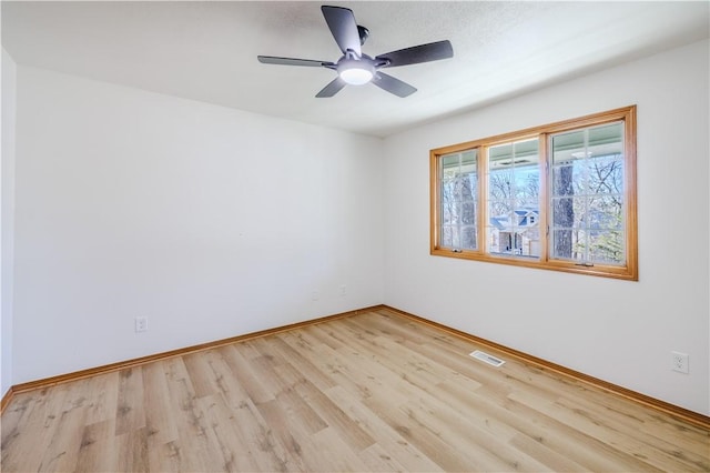 spare room with ceiling fan and light hardwood / wood-style floors