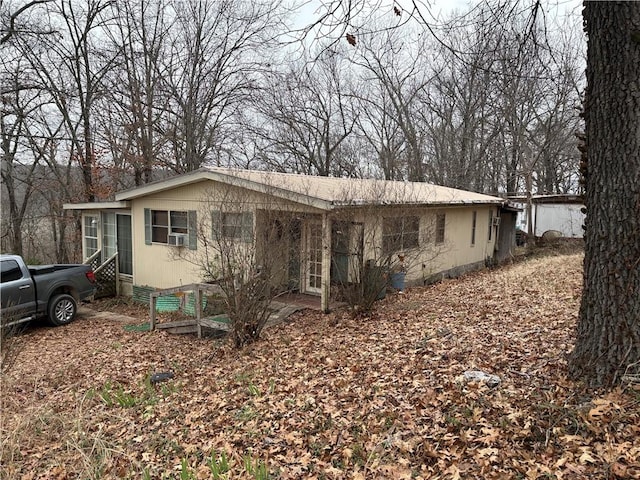 view of front of property featuring cooling unit