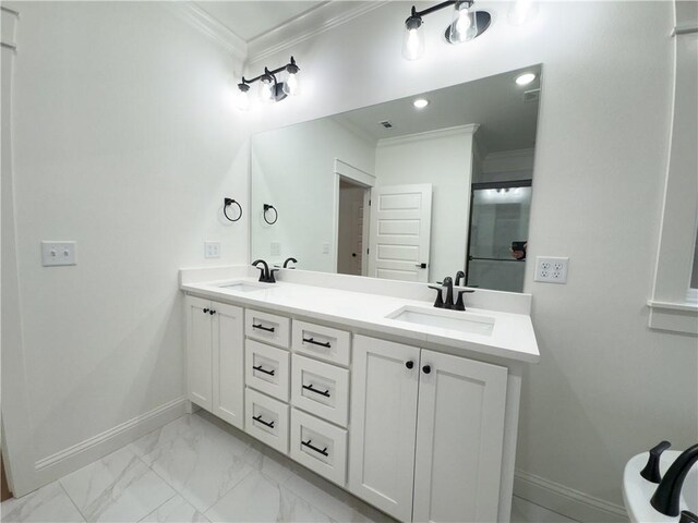 bathroom with vanity and ornamental molding