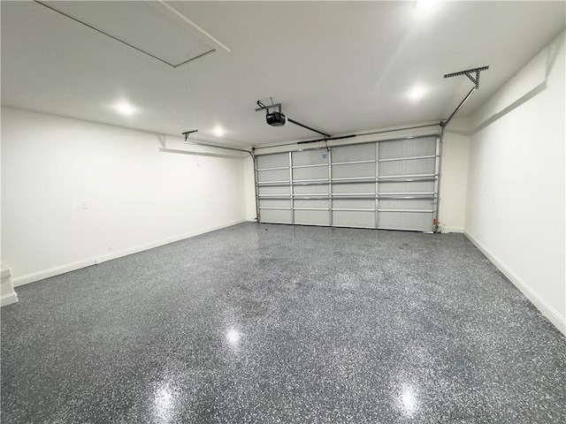 garage featuring baseboards and a garage door opener