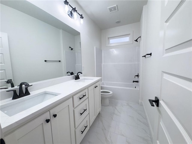 bathroom with toilet, marble finish floor, a sink, and visible vents