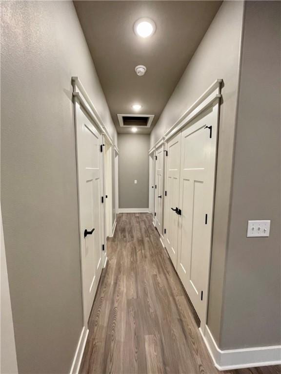 corridor featuring hardwood / wood-style flooring