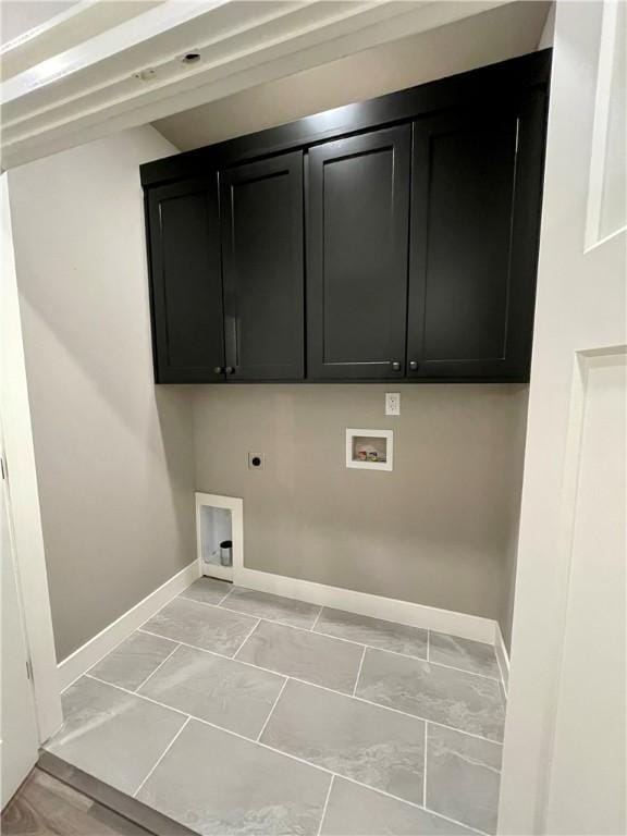 laundry area featuring washer hookup, electric dryer hookup, and cabinets