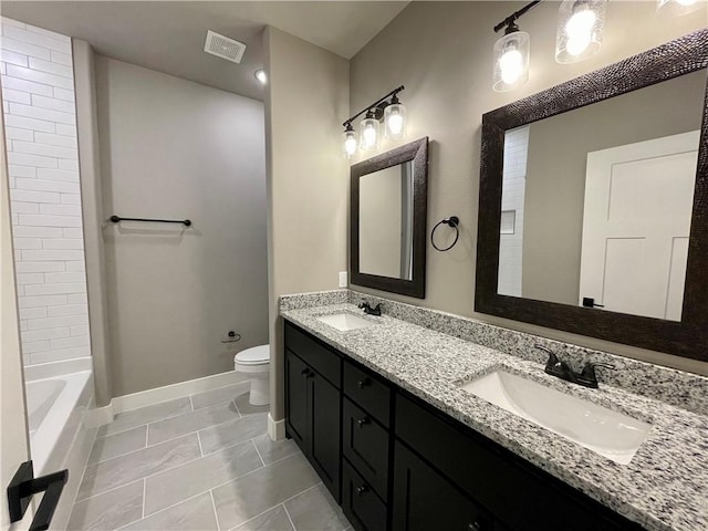 full bathroom featuring tile patterned floors, vanity, tub / shower combination, and toilet