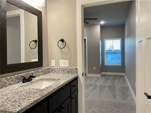 bathroom with ceiling fan and vanity