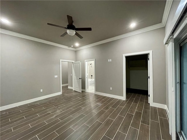 unfurnished room with ceiling fan and crown molding