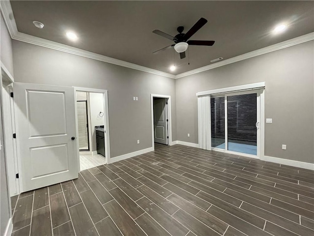 interior space featuring ceiling fan and crown molding