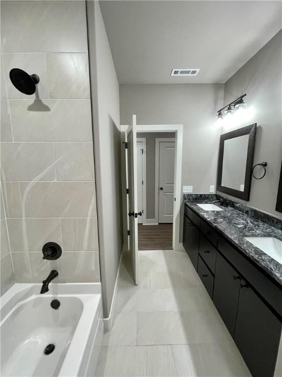 bathroom with vanity and shower / bath combination