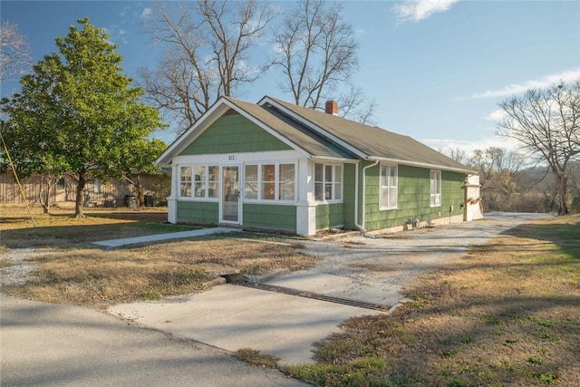 view of front facade with a sunroom