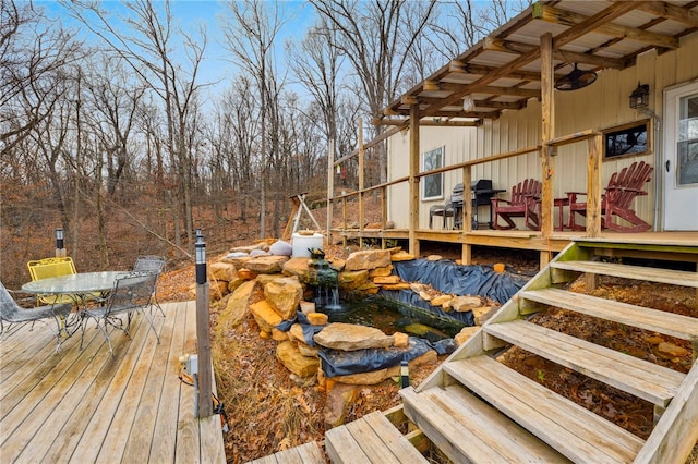 19959 Rheas Community Rd, Lincoln, AR 72744 - deck with outdoor dining space, a garden pond, and a grill