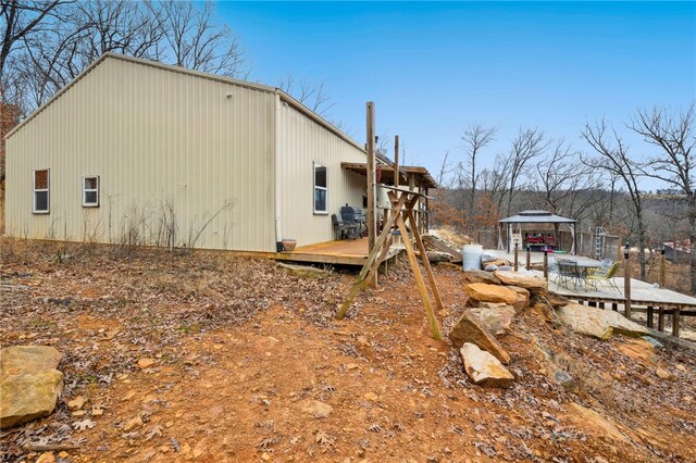 view of side of property with a wooden deck