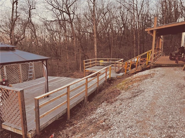 view of yard featuring a deck and a gazebo