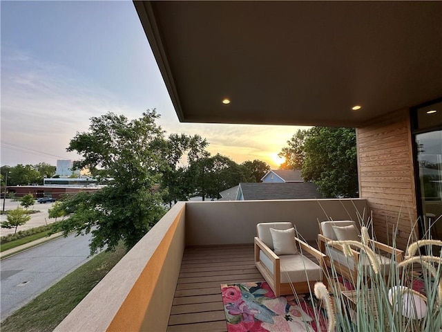 view of balcony at dusk