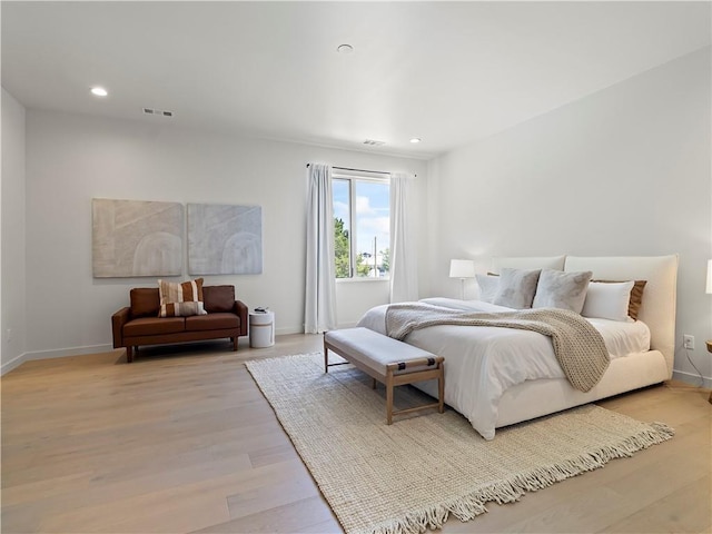 bedroom with light wood-type flooring