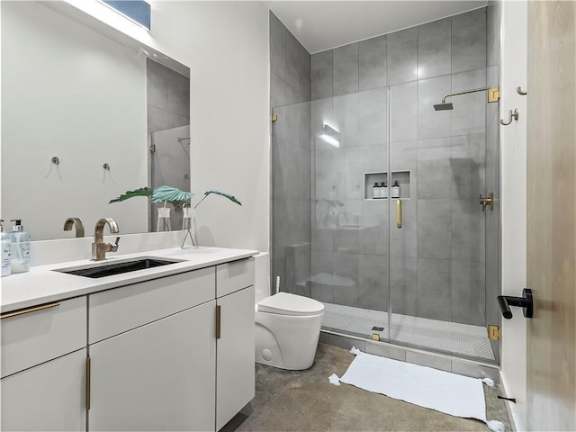 bathroom featuring vanity, toilet, an enclosed shower, and concrete floors