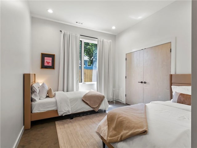 carpeted bedroom with a closet