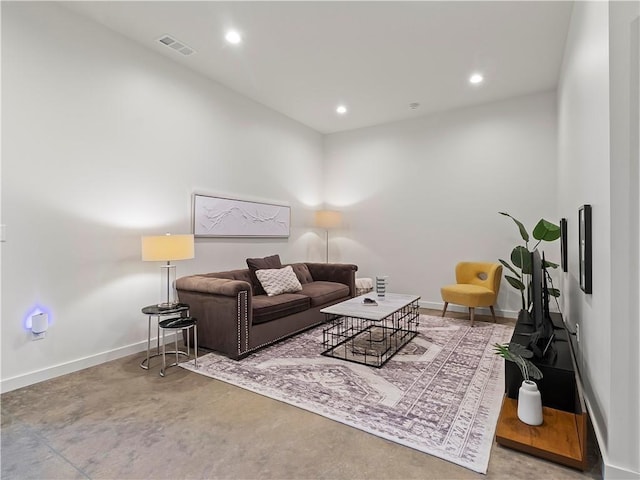 living room with concrete flooring, recessed lighting, visible vents, and baseboards