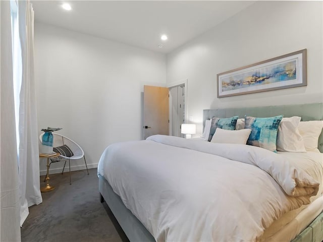 bedroom featuring recessed lighting and baseboards