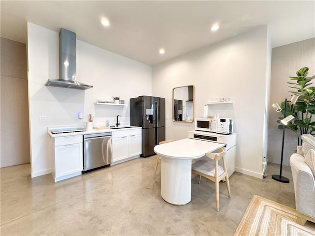 kitchen with concrete floors, a sink, wall chimney range hood, dishwasher, and black refrigerator with ice dispenser