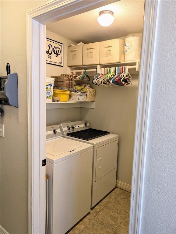 clothes washing area with independent washer and dryer