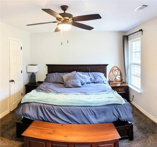 carpeted bedroom featuring ceiling fan