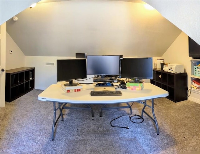 home office featuring lofted ceiling and light carpet