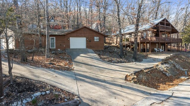 view of front facade featuring a garage and a deck