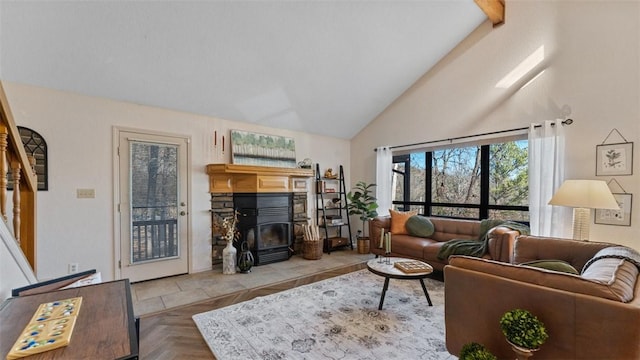 living area with high vaulted ceiling