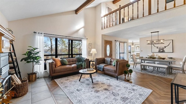 living room with a chandelier, a high ceiling, and beam ceiling