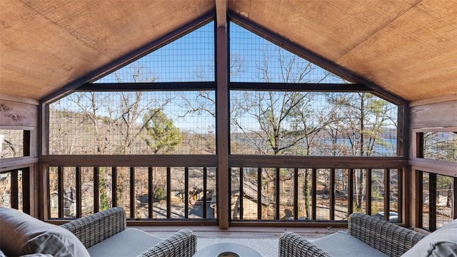 unfurnished sunroom with wood ceiling and vaulted ceiling