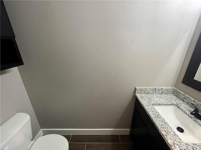 bathroom with tile patterned floors, vanity, and toilet