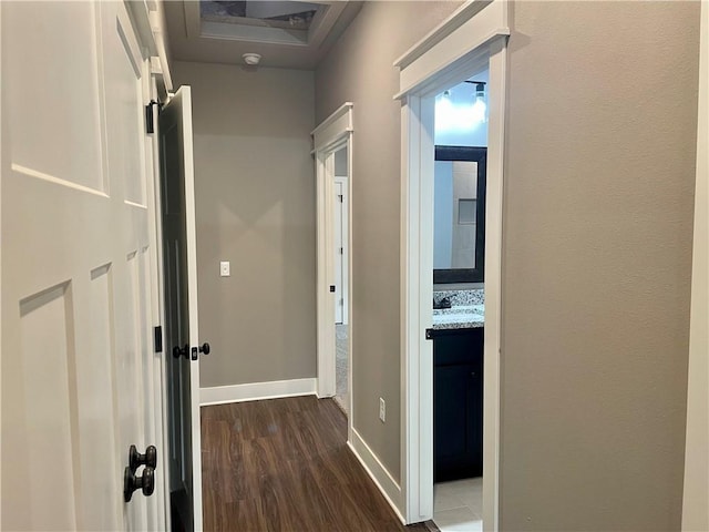 hallway with dark hardwood / wood-style floors and sink